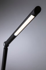 Black LED desk lamp with long slim light strip for modern workspace lighting
