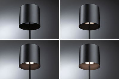 Quatre vues d'une lampe sur pied noire en métal avec abat-jour cylindrique et lumière blanc chaud.