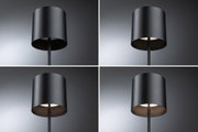 Four views of a black metal floor lamp with cylindrical shade and warm white LED light