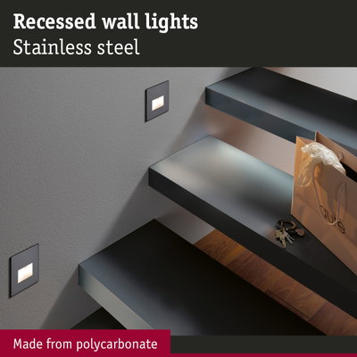 Recessed stainless steel wall light with polycarbonate in modern stairwell illuminating steps