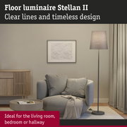 Stellan II floor lamp with grey fabric shade and metal base in modern living room setting