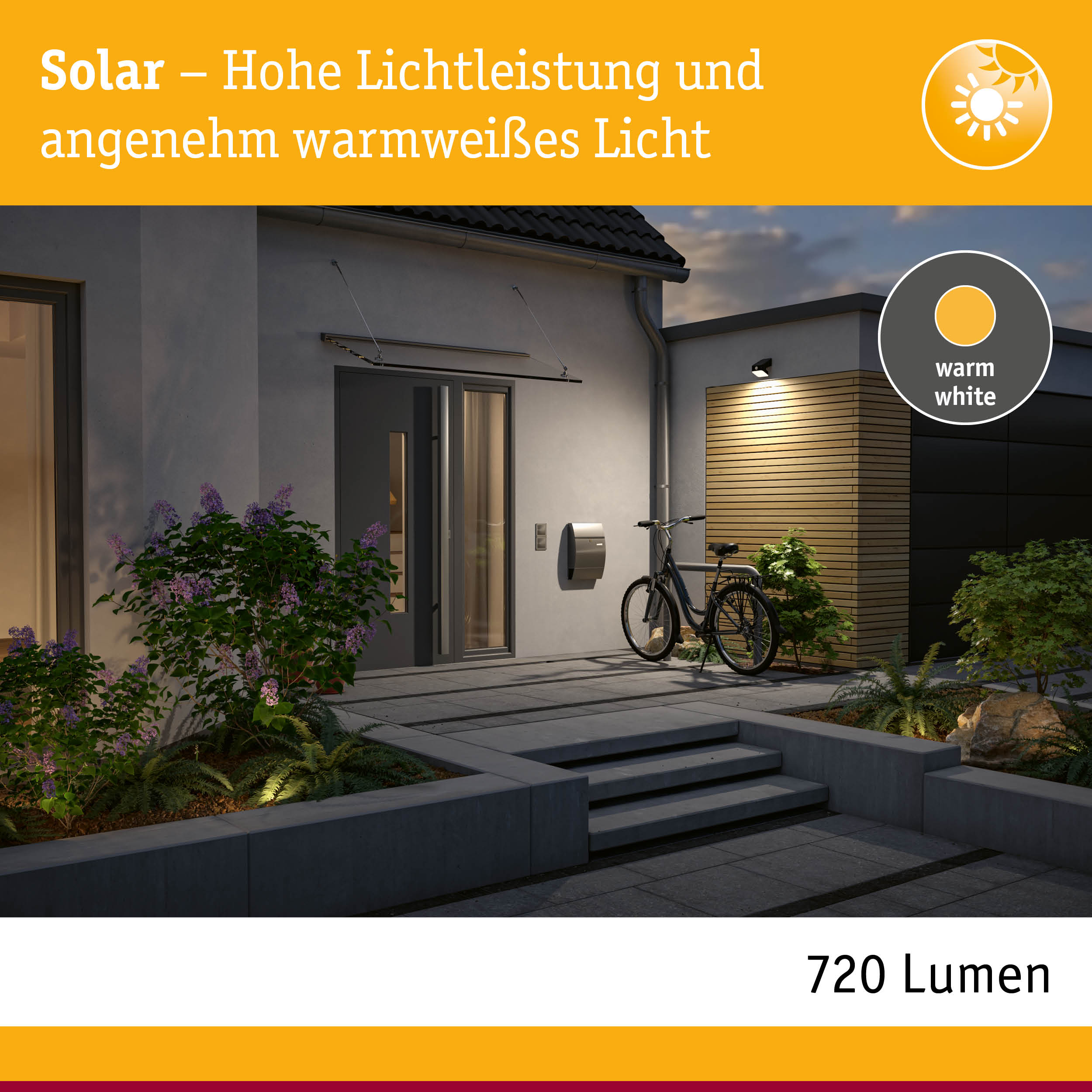 Solarleuchte mit hoher Lichtleistung und warmweißem Licht an moderner Hausfassade bei Abenddämmerung