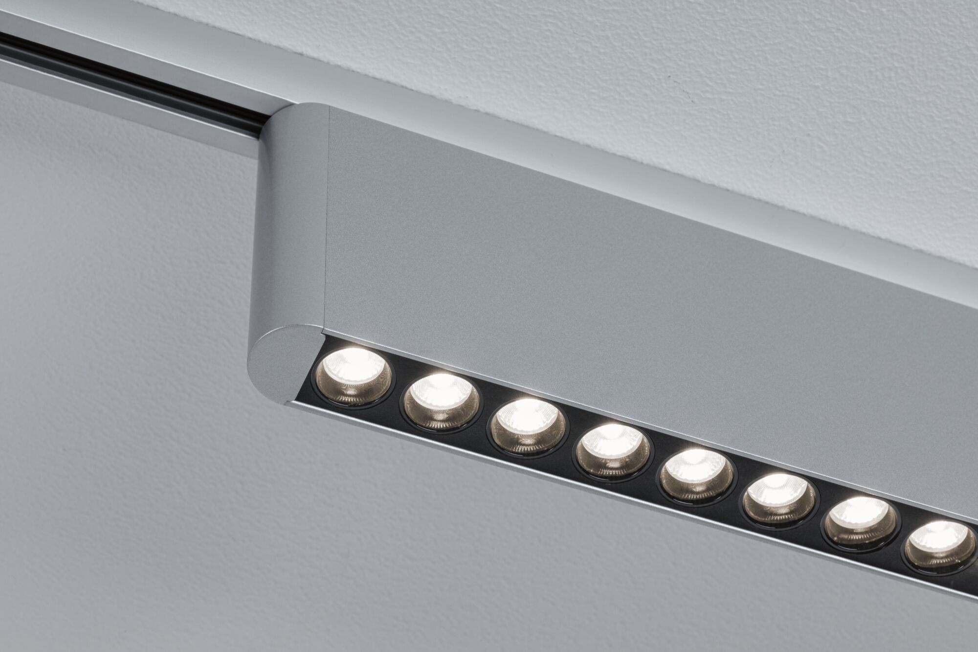 Modern silver aluminium ceiling spotlight with multiple LED lights for indoor lighting