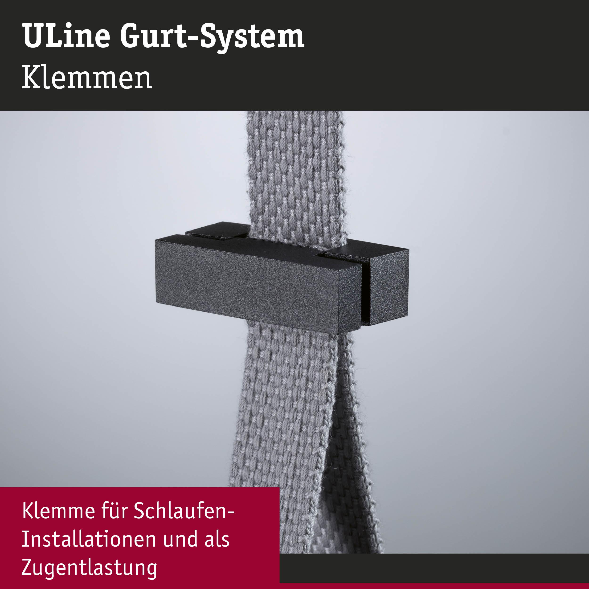 Schwarze Kunststoffklemme am grauen Textilgurt für Schlaufen-Installationen und Zugentlastung