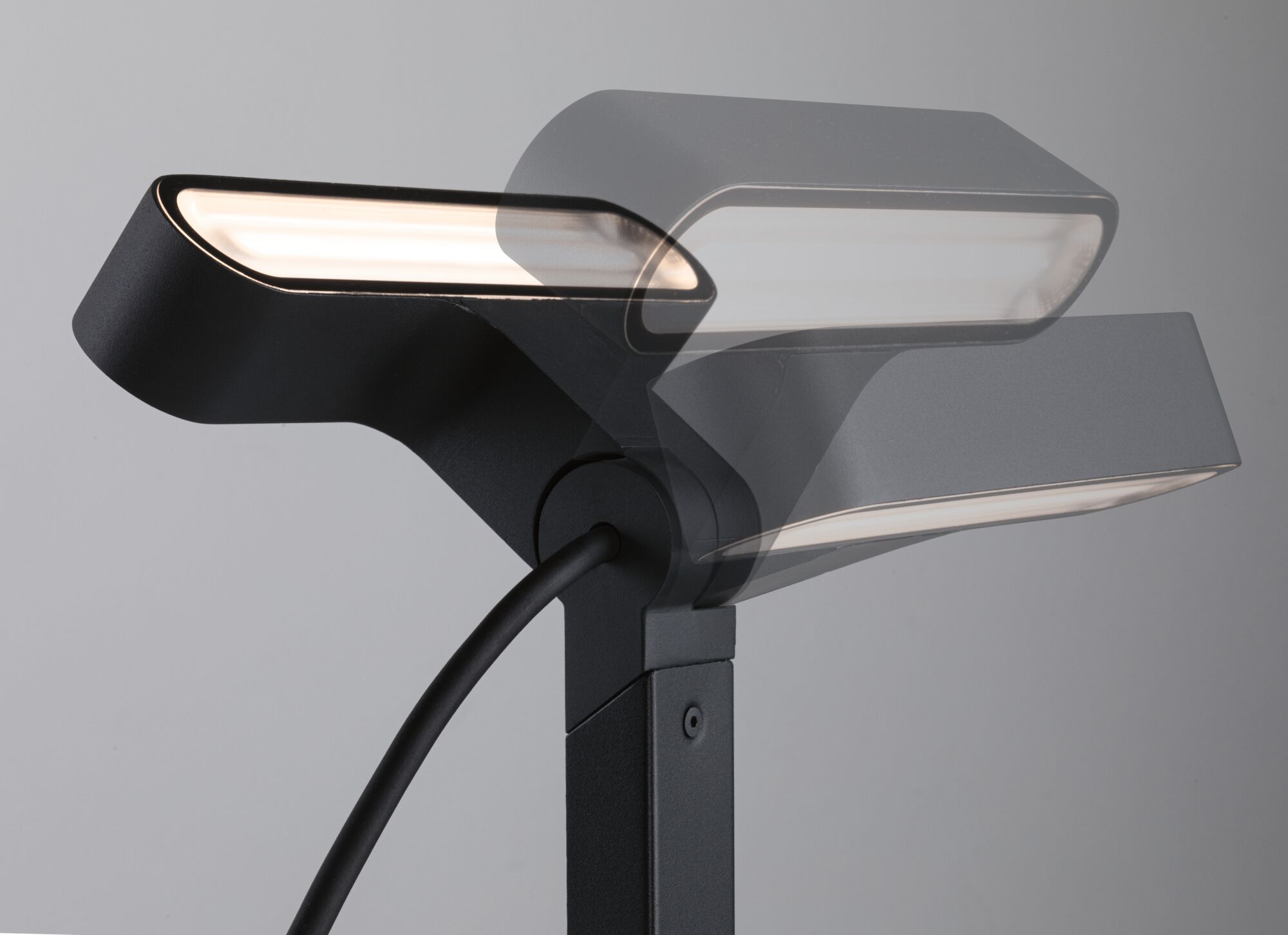 Black metal LED floor lamp with adjustable head for modern home lighting and decor