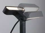 Black metal LED floor lamp with adjustable head for modern home lighting and decor