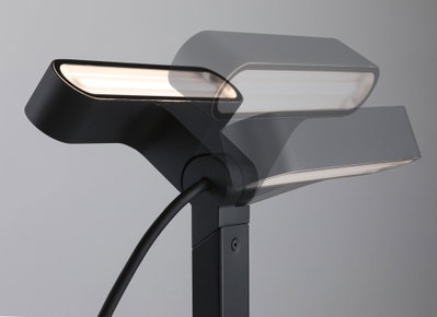 Black metal LED floor lamp with adjustable head for modern home lighting and decor