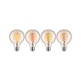 Four decorative LED bulbs with colored spiral filaments and clear glass for ambient lighting effects