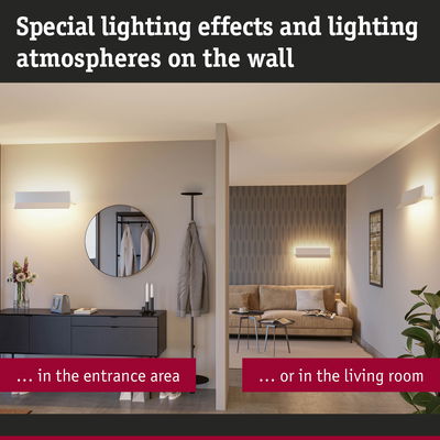 Modern white wall lights with warm glow in entrance and living room for atmospheric lighting effects