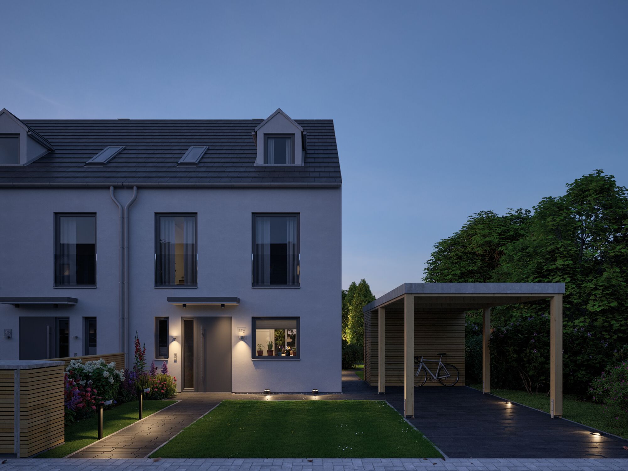 Modernes Haus mit grauer Haustür und LED-Außenbeleuchtung an Weg und Carport bei Abenddämmerung