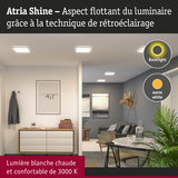 Salon éclairé par des luminaires Atria Shine LED avec lumière blanche chaude et rétroéclairage