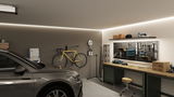 Modern garage with grey car, yellow bike, workbench and LED wall lighting for workshop use.