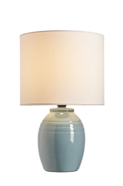 Table lamp with blue ceramic base and white fabric shade for ambient lighting