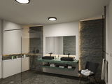Modern bathroom with green marble vanity, black basins, and indirect LED lighting for ambiance.