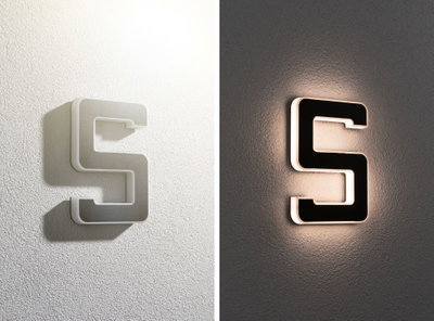 Moderne LED-Wandleuchte in S-Form mit schwarzer und weißer Oberfläche, dekorative Innenbeleuchtung.