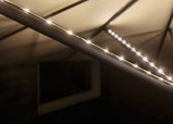 Warm white LED light strip with black housing for ambient indirect lighting