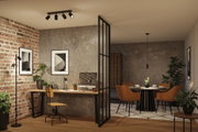 Salon moderne avec spots au plafond en métal noir, lampadaire, chaises marron et bureau en bois