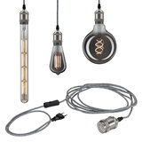 Trois ampoules LED vintage avec câble textile gris et douille métal pour éclairage décoratif.