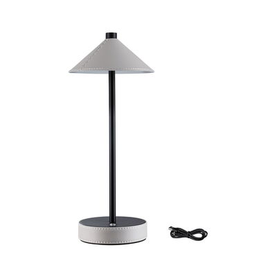 Modern table lamp with grey leather shade and black metal frame, includes USB charging cable