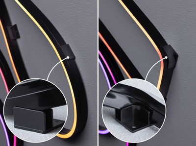 Zwarte LED-wandbeugels met gele, oranje en paarse neonbuizen voor moderne sfeerverlichting.