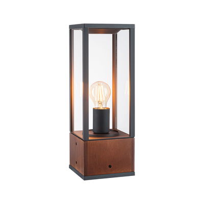Moderne tafellamp met houten voet en zwart metalen frame, heldere glazen kap, zichtbare LED-lamp
