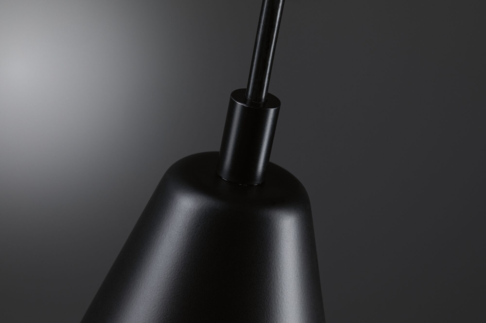 Black metal pendant lamp with matte finish for modern interior lighting and design accents