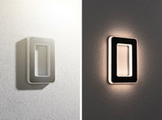 Modern rectangular LED wall light in white and black with warm glow for stylish home lighting