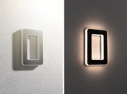 Modern rectangular LED wall light in white and black with warm glow for stylish home lighting