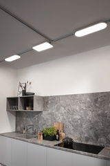 Modern kitchen with grey stone countertop and LED ceiling lights for efficient lighting