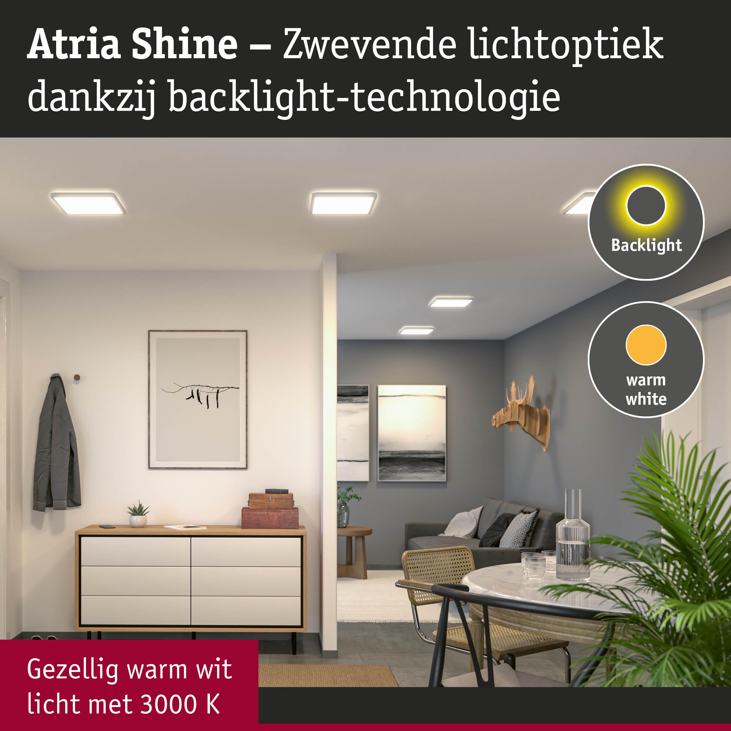 Woonkamer met Atria Shine LED-plafondlampen in warm wit licht en backlight-technologie
