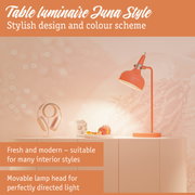 Orange metal Luna Style table lamp with adjustable head for focused lighting in modern interiors