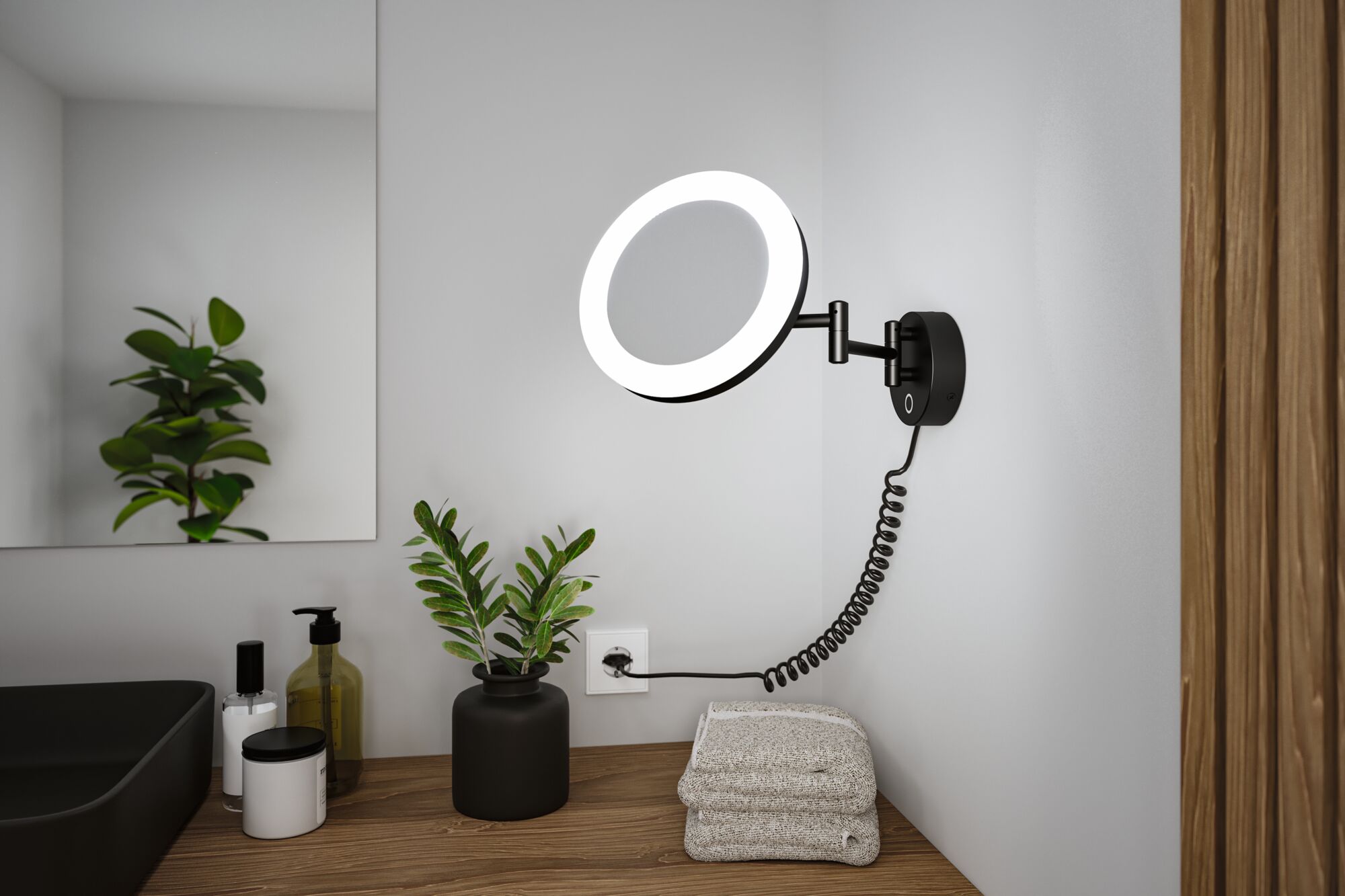Schwarze LED-Wandleuchte mit rundem Leuchtring und flexiblem Arm über Holzablage im Badezimmer.