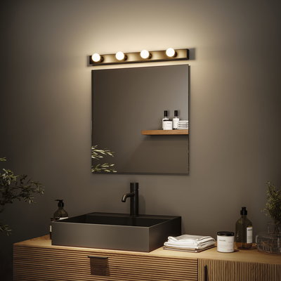 Modern bathroom with black metal sink and wooden cabinet, illuminated by LED mirror light fixture.