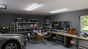 Modern garage with grey car, white bike on stand, and LED ceiling lights for workshop illumination