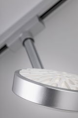 Modern silver LED ceiling spotlight with white diffuser and adjustable arm for accent lighting
