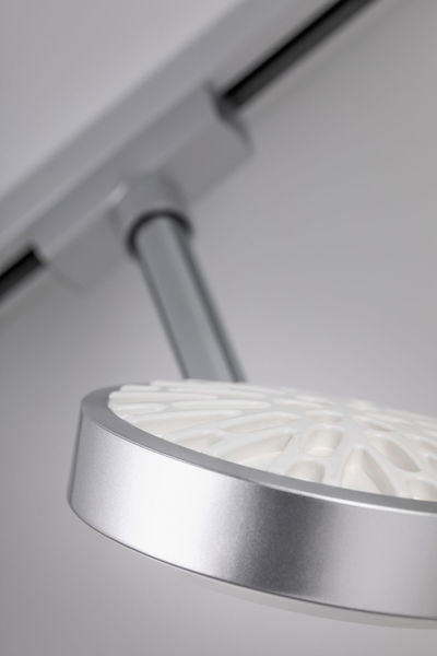 Modern silver LED ceiling spotlight with white diffuser and adjustable arm for accent lighting
