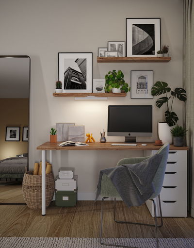 Modern home office with wooden desk, green chair, and LED wall light providing soft illumination.