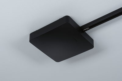 Black square metal ceiling light with sleek surface for modern interior lighting solutions.