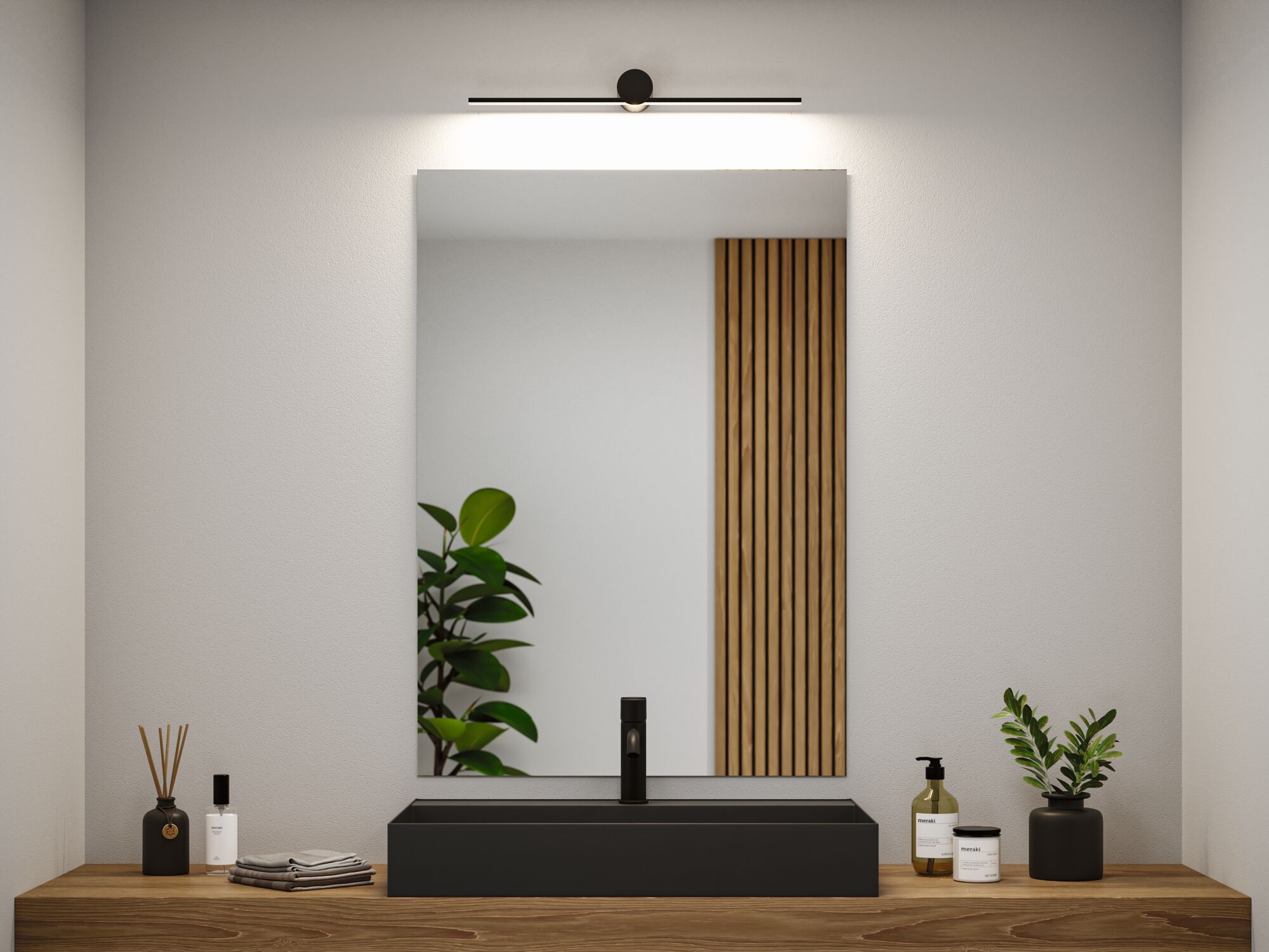 Black LED mirror light above rectangular black sink on wooden countertop in modern bathroom