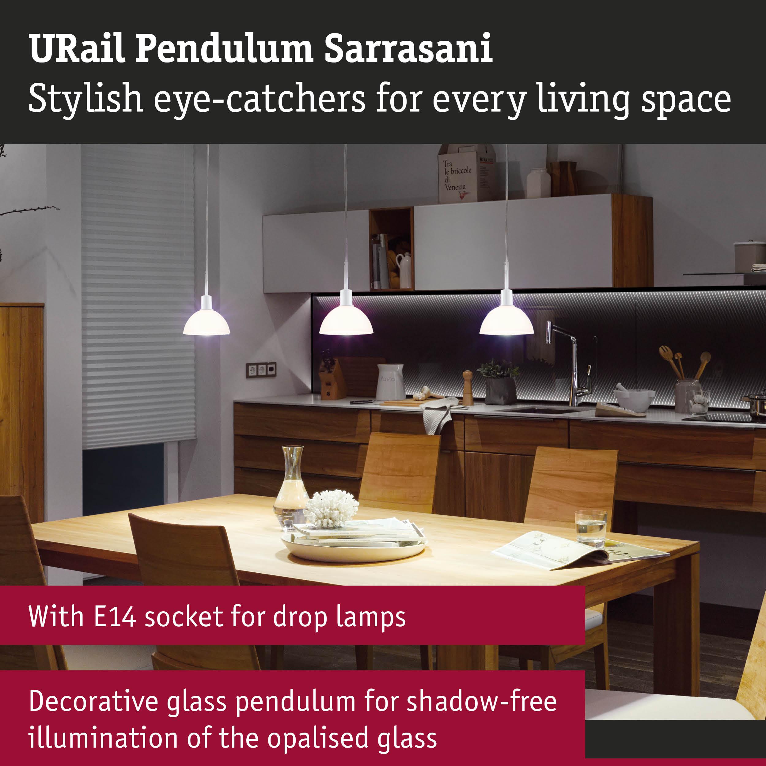 Modern white opal glass pendant lamps above wooden table in stylish kitchen setting