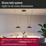 Modern ULine lighting system with black pendant lamps above round dining table in living room