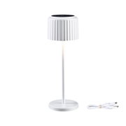 White table lamp with ribbed shade and USB charging cable, modern LED lighting solution