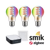 Trois ampoules LED colorées à filament en spirale avec commande domotique et technologie Zigbee.