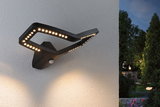 Black LED outdoor wall light with motion sensor and warm white light for garden and terrace.