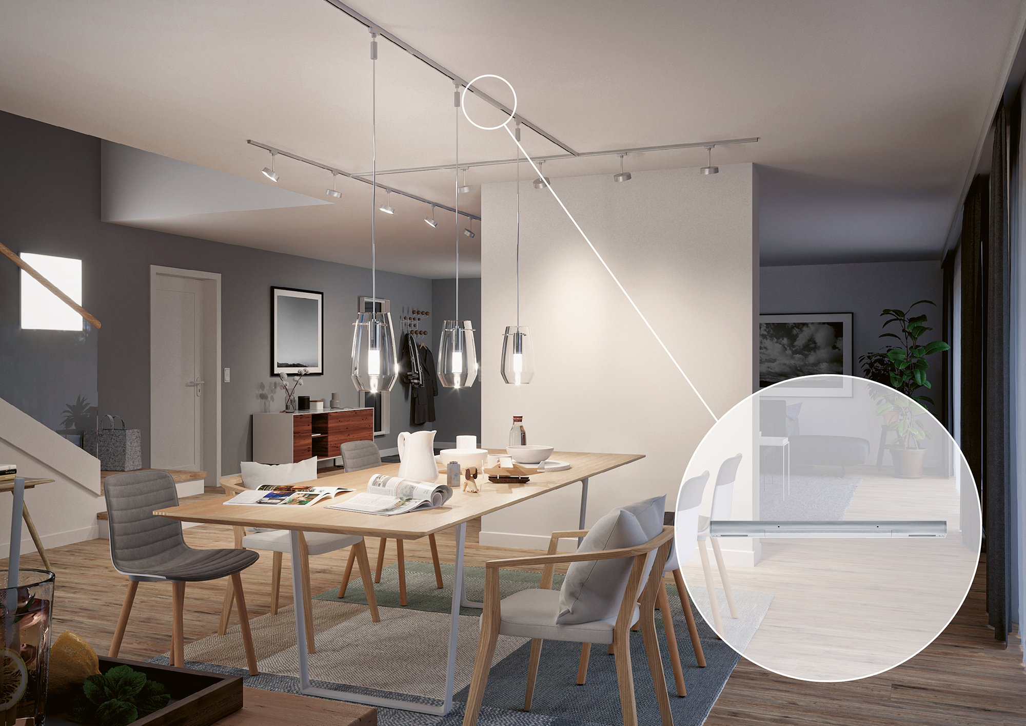 Modern dining area with wooden chairs and table, glass LED pendant lights and aluminium ceiling track