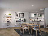 Modern dining area with light wood chairs and table, open white kitchen, and illuminated workspace setup