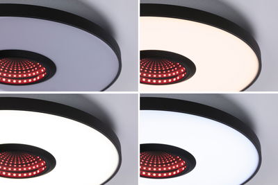 Vier Ansichten einer schwarzen Deckenleuchte mit dimmbarer weißer LED-Fläche und rotem LED-Mittelpunkt