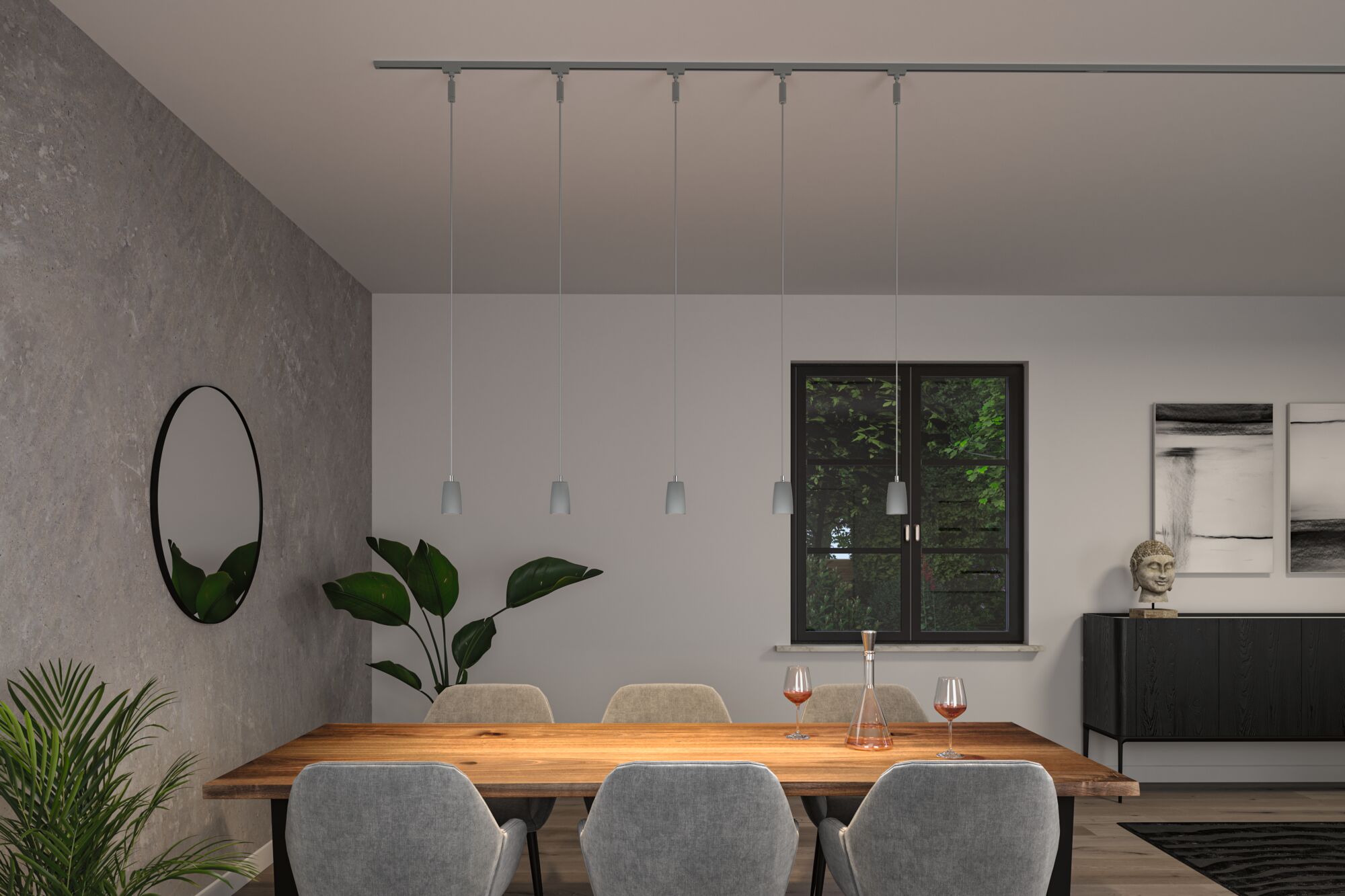 Modern dining table lighting with five grey pendant lamps on track system in minimalist dining room.