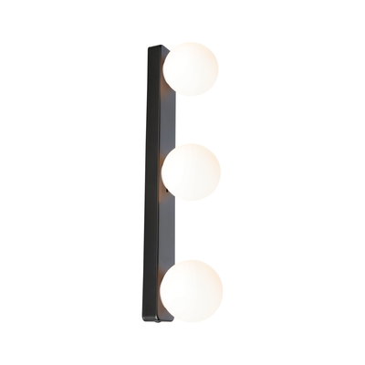 Modern wall light with three white glass globes and black metal frame for living spaces