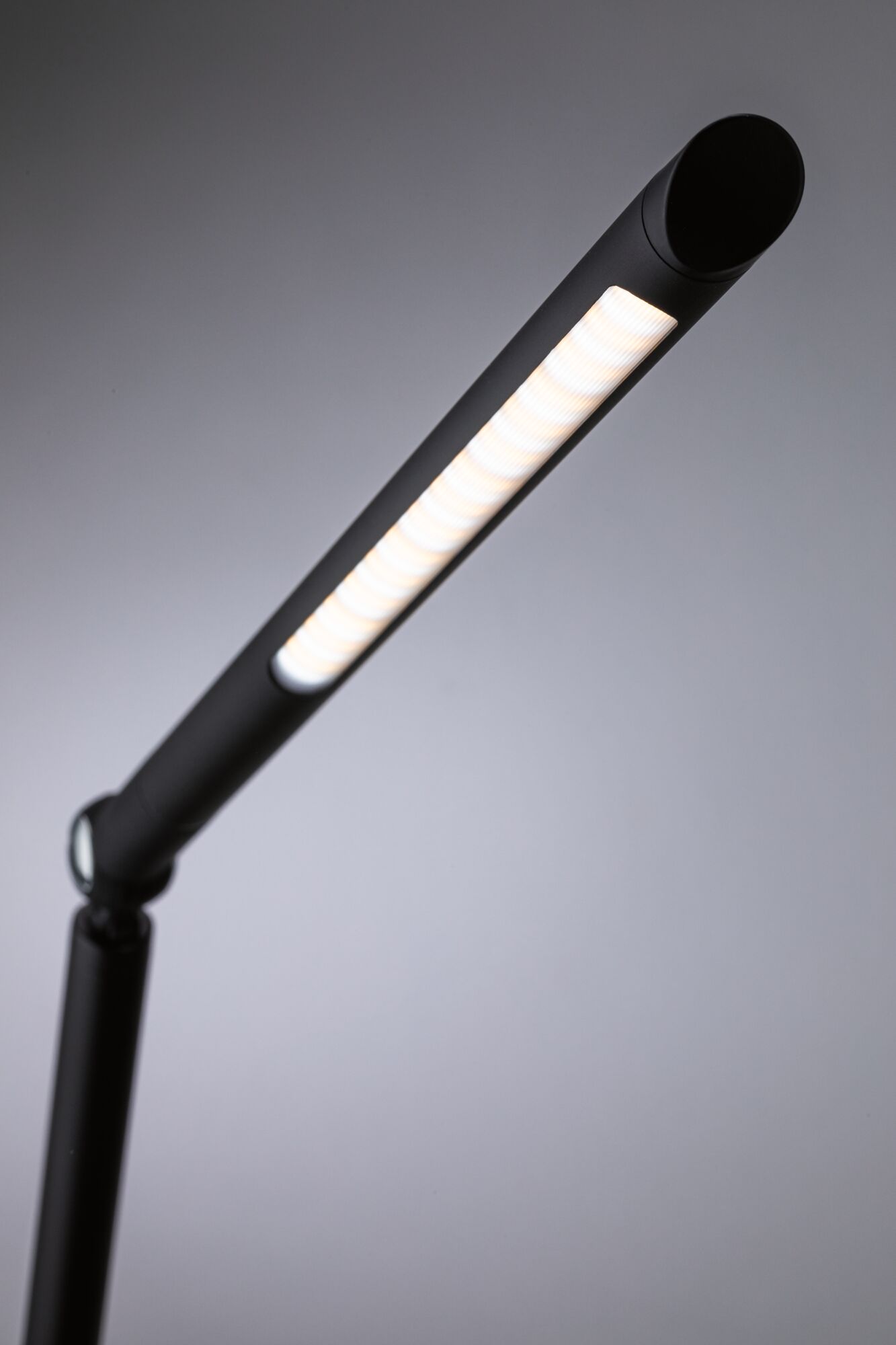 Black LED desk lamp with long light strip for modern workspace lighting